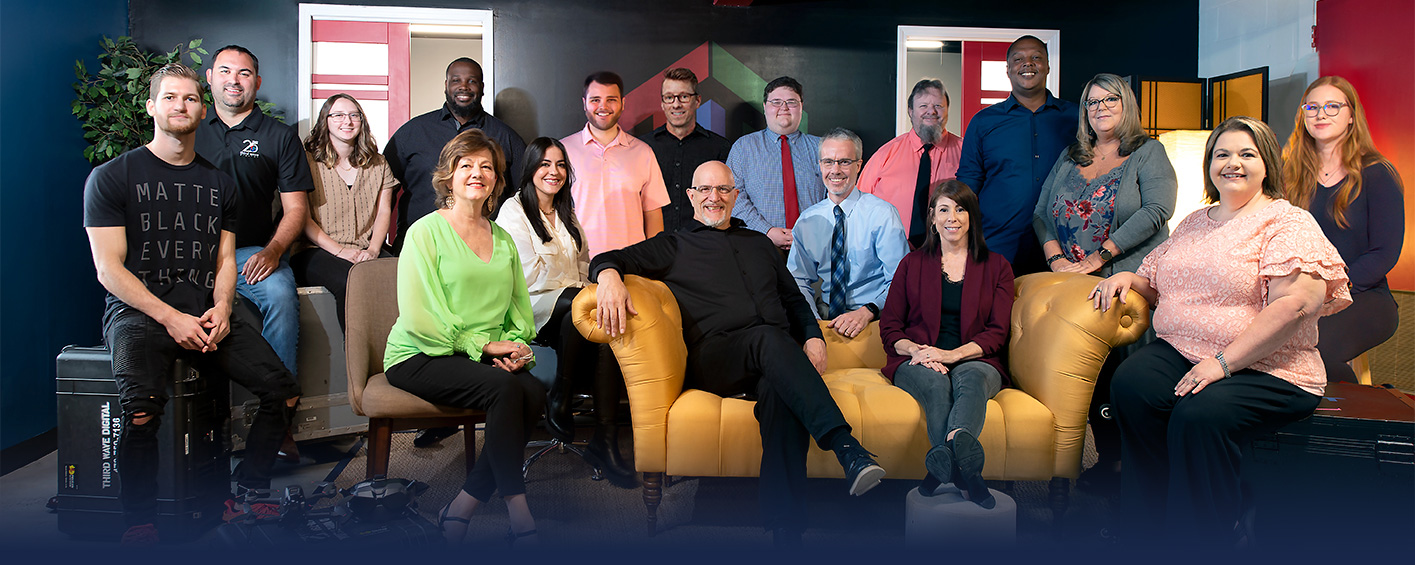 Team TWD posing for group shot in office